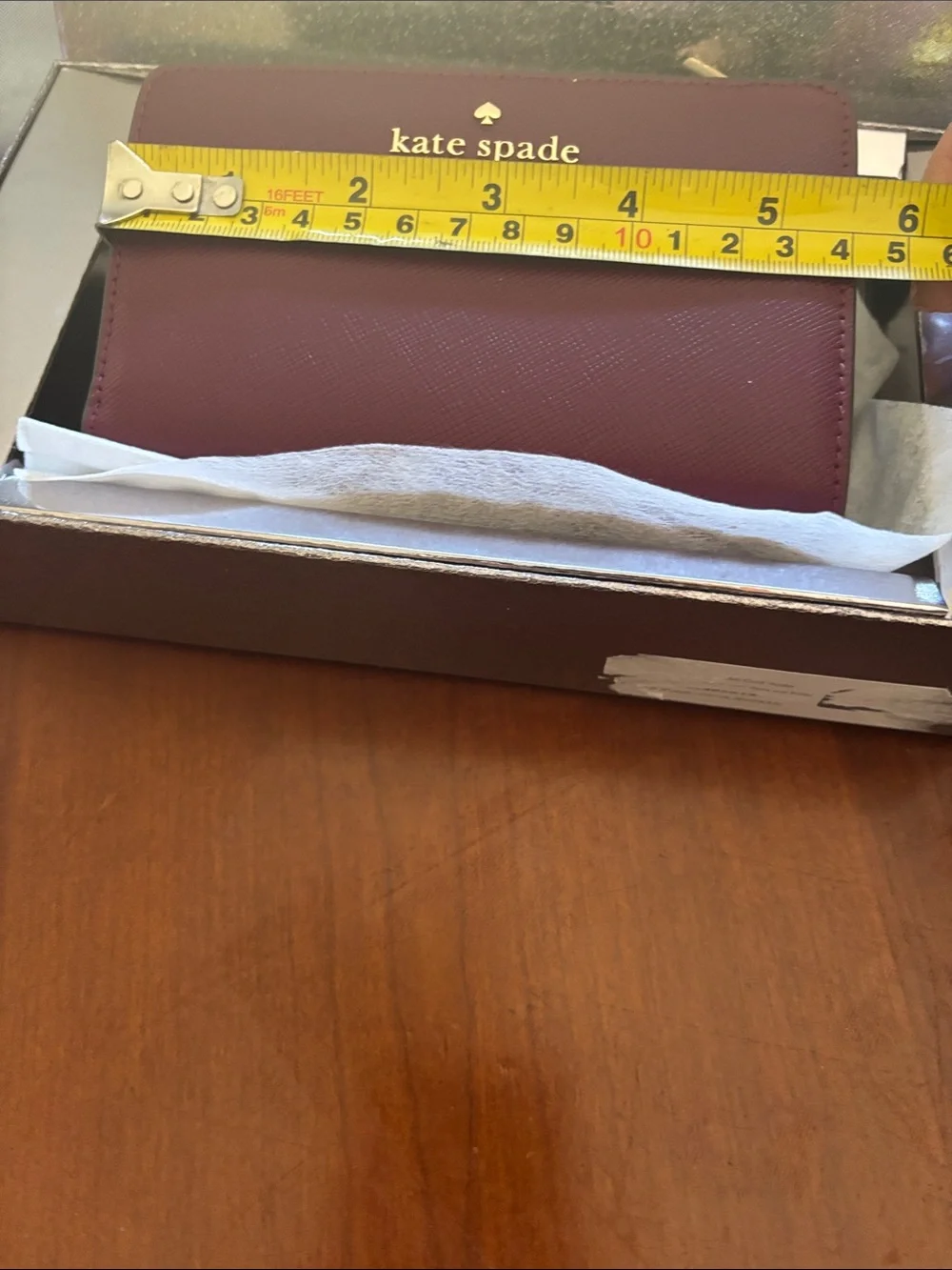 kate spade burgundy and gold zip-around wallet